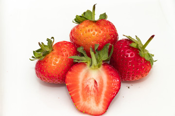 Ripe strawberries on a white background.Close up.