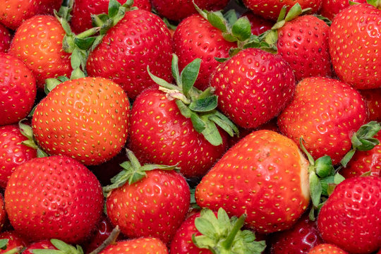 Fresh strawberry as background. Close up, top view, high resolution product. 