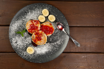 Cottage cheese pancakes on a dark plate