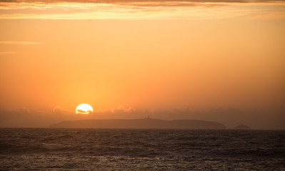 sunset by the ocean