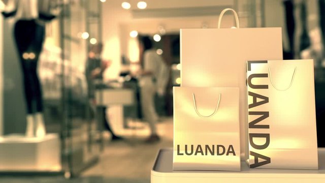 Bags with Luanda text. Shopping in Angola related conceptual 3D animation
