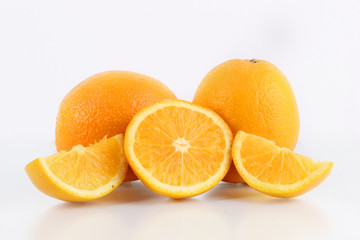 fresh orange fruit and ice with a white background