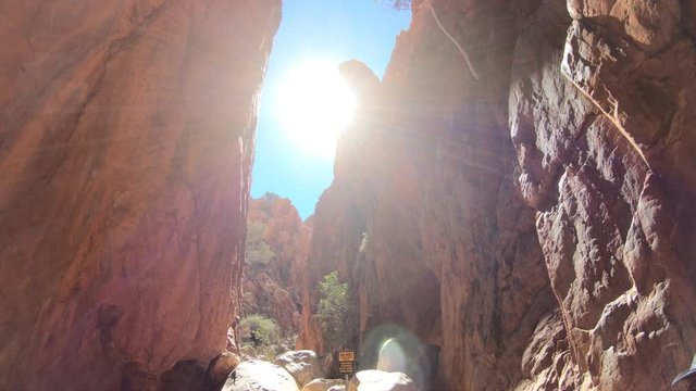 Mid-day sun rays over a gorge canyon Standley Chasm,Aboriginal Land, West MacDonnell Ranges. Angkerle Atwatye is spectacular geological icon of Central Australia. Outback Red Centre Northern Territory