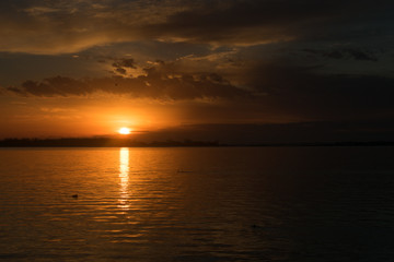 Naklejka na ściany i meble sunset over a lake