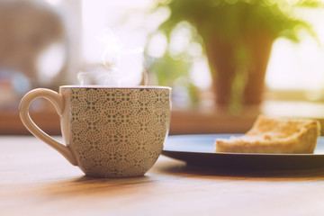 Morning coffe with with apple pie on a wooden table. Morning coffe concept