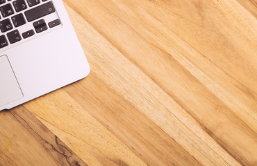 Gray laptop on a wooden table. Copy space. Social, media, Marketing concept