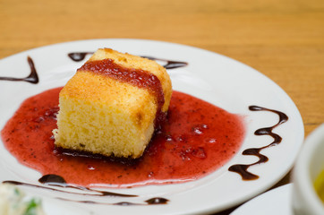 cake dessert and red fruit sauce