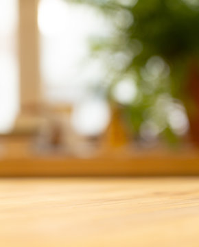 Wooden table background near the blurred window in the living room