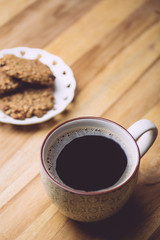Morning coffe with oatmeal cookies on a wooden table. Morning coffe concept