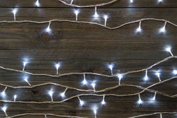 lights on dark wooden background, free space