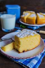 cornmeal cake custard dessert from corn flour with lemon zest decorated with powdered sugar