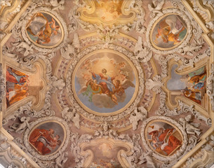 RIVA DEL GARDA, ITALY - JUNE 13, 2019: The ceiling fresco of Assumption of Virgin Mary in the cupola of church Chiesa di Santa Maria Assunta (Cappella del Suffragio) by  Teofilo Polacco (19 cent.).