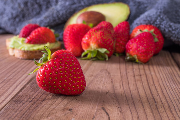 fresh natural red strawberries on wooden background