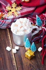 Christmas marshmallows and new year decorations on wooden background. Winter holidays, New Year mood