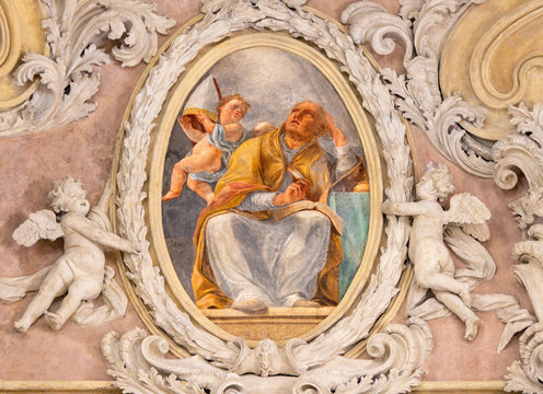 RIVA DEL GARDA, ITALY - JUNE 13, 2019: The baroque fresco of St. Augustine doctor of the west catholic church in church Chiesa di Santa Maria Assunta  by Teofilo Polacco from beginn of 19. cent..