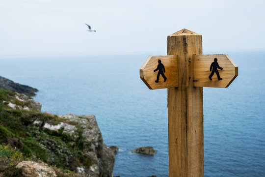 Naklejki Wooden signpost on hiking trail along Pembrokeshire Coast