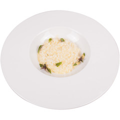 Risotto rice on white plate isolated.
