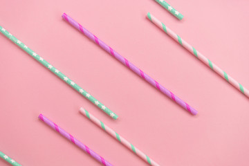 Colorful Paper coctail tubes on the pink background. Eco friendly. Zero Waste