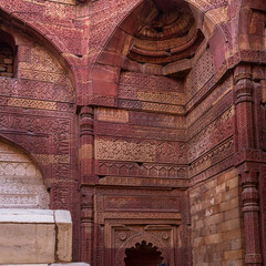 Fototapeta na wymiar Fresco, Motifs and Tomb of Iltutmish in the Jain Temple inside Qutb Minar Complex. UNESCO World Heritage in Delhi, India, Asia.