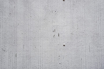 Texture of a concrete wall with cracks and scratches which can be used as a background
