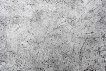 Texture of a concrete wall with cracks and scratches which can be used as a background