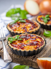 Homemade onion open mini pies. © Saprunova Marina