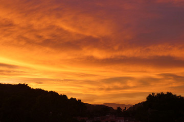 Bright Vibrant Orange And Yellow Colors Sunset Sky .