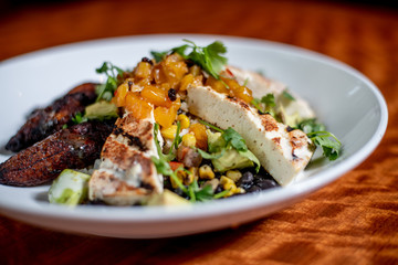 Tofu, Avocado and Mango Garnished Salad with Deep fried Ripe Plantains