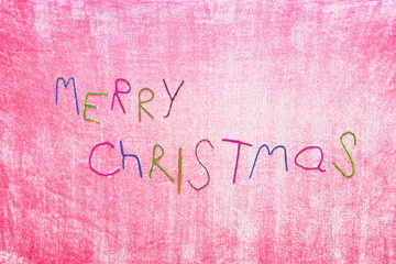 A Tinsel "Merry Christmas" Sign, Showing the Seasonal Words of Happiness on a Pink Spotted Background.