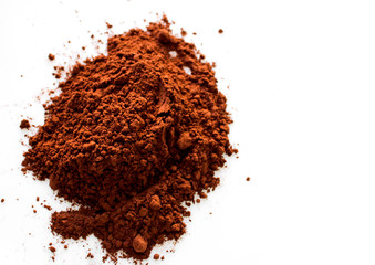 pile of cacao powder on white background, top view isolated,ground cocoa 