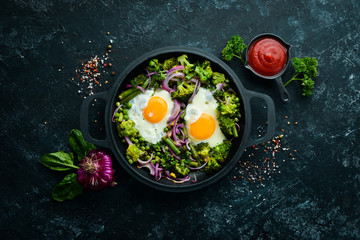 Vegetable Shakshuka in a pan. Fried eggs with vegetables: broccoli, green peas, beans, onions. Top view. Free space for your text.