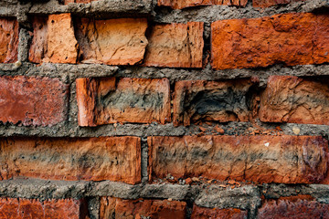wall of multi-colored cracked bricks