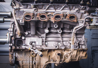 Rusty V-8 car engine partially taken apart