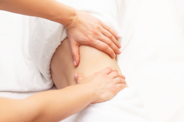 Fototapeta na wymiar Massage Therapist Massaging a Womens Stomach. Massage and body care. Spa body massage woman hands treatment.