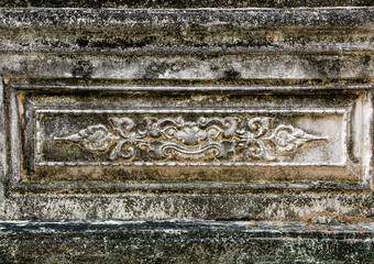 old plastered wall with spots from water ,High relief sculpture, Ancient Thai pattern.
