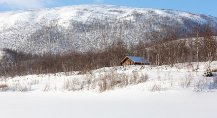 Wood cabin on riverbank for hunters or fishermans,