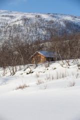 Wood cabin on riverbank for hunters or fishermans,