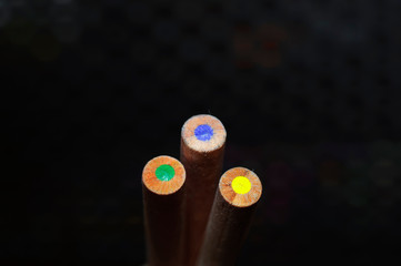 Three wooden crayons, yellow, green and blue