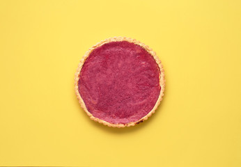 Cranberry pie on yellow background.  Cranberry curd tart