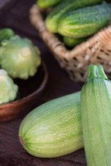A fresh cucumbers, zucchini and squashes closeup
