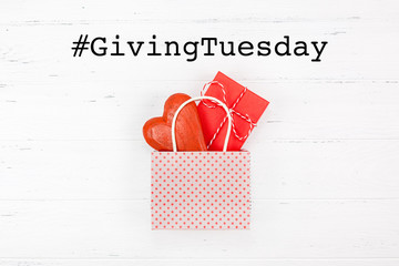 Giving Tuesday concept with heart and gift in bag