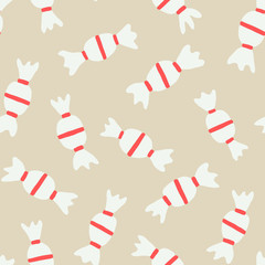 Hand painted seamless pattern with candies in red and white on beige background.