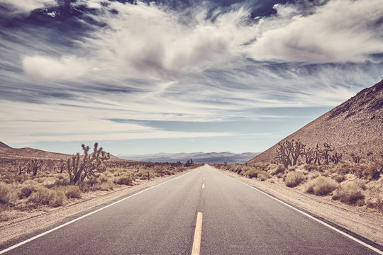 Scenic road in the Death Valley, color toning applied, USA.