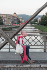 portrait of fashionable young European Muslim woman with hijab walking on the streets of Sarajevo....