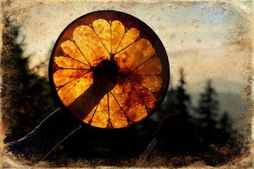 shamanic drum in nature, shamanic drum with crystal, old effect and border.