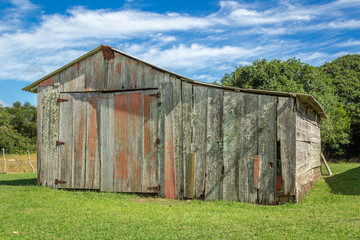 Modest wooden house used as a deposit by locals in a small town in the city of São José do Norte, in southern Brazil.