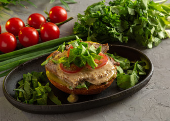 bruschetta with roast beef - baked veal tenderloin with salted cucumber, tomato, spinach and mustard sauce on a warm fried bun