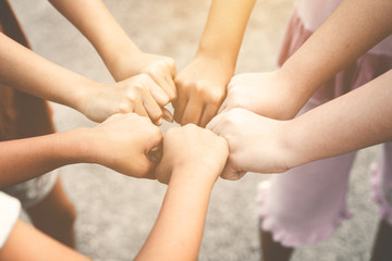 Close-up of children playing in a group, successful initial concepts, combined energy
