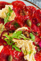 delicious beef jerky, olives and herbs on plate
