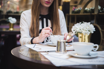 the girl in the cafe. at the table